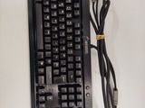 a black keyboard with a cord attached to it