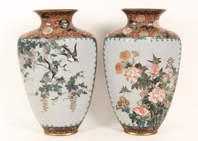 two vases that have birds and flowers on them