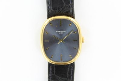 an image of a close up of a wrist watch on a white surface