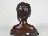 a close up of a statue of a woman with a black hair