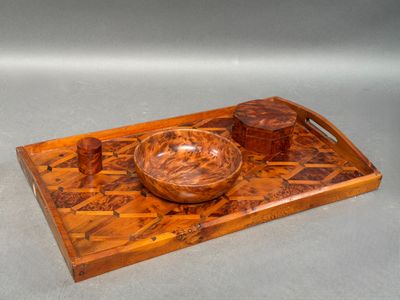 a wooden tray with a bowl on it on a table