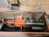a small machine that is sitting inside of a wooden box