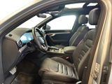 the interior of a car with the door open and the steering wheel down