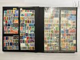 a lot of different stamps on the pages of a book