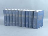 a set of six blue books sitting on top of each other