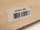 a label on a wooden box with a barcode on it