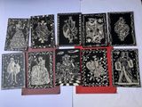 a bunch of cards with black and white designs on them