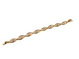 a close up of a gold bracelet on a white background