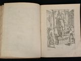 an open book with a drawing of a man and a woman sitting on a bench