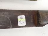 a knife with a sticker on it sitting on a table