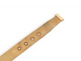 a close up of a wooden watch band on a white surface