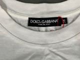 white t - shirt with dolce gabbaana label on it