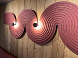 three lights that are on the wall in the room