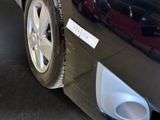 a close up of a car tire with a sticker on it