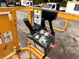 a close up of a parking meter on a yellow gate