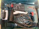 a box with a drill and a cord in it