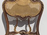 an image of a chair that is sitting on a white wall
