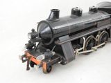 a toy train on a white surface with a white background