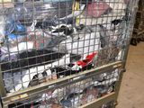a large metal cage filled with lots of assorted items