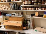 many bottles and boxes on the shelves in the room