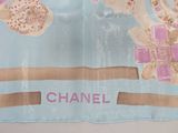 a scarf with a picture of a chanel logo on it