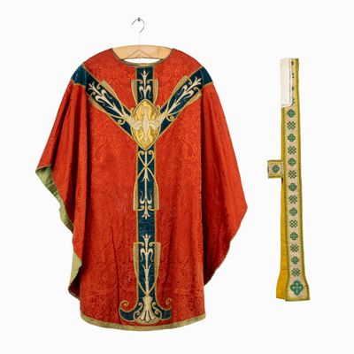 an image of a red robe with a cross on the front and a gold cross on the back