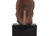 an image of a sculpture of an elephant ' s head on a black stand