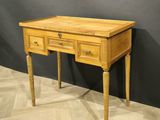 an image of a wooden desk with drawers on it