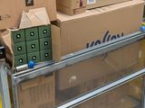 boxes are stacked on top of a cart in a warehouse