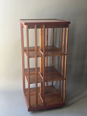 a small wooden display case with a glass door