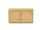 a gold leather wallet with a keyhole on the front
