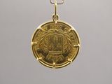 an image of a gold coin on a chain