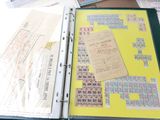 a binder that has a lot of papers on it