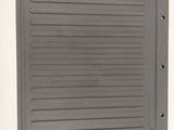 a metal door with a metal handle on a white wall