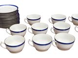 a lot of cups and a stack of plates on the table