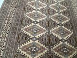 an image of a large oriental rug on a wooden floor