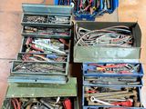 many different types of tools in a box on the floor