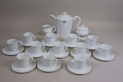 a lot of cups and saucers sitting on the table