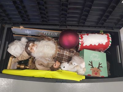 a black box filled with toys and other holiday items