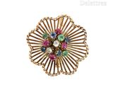 an image of a gold ring with multi colored stones on it
