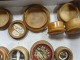 many wooden bowls and spoons in a box