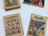 Plusieurs bandes dessinées anciennes sont exposées dans une vitrine.