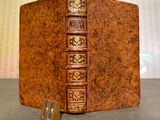 an old book that is sitting on a table