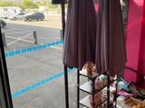 two umbrellas that are sitting on a table in front of a window