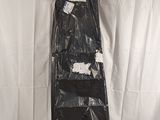a black bag hanging on the wall next to a toilet