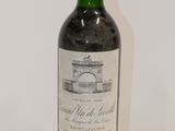 a bottle of wine that is sitting on a table