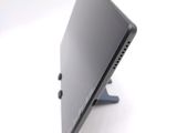 a close up picture of a computer monitor on a stand