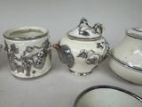four different types of teapots sitting on a table