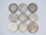 six different types of coins are shown on a white surface