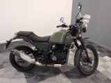 a motorcycle that is sitting on a checkered floor
